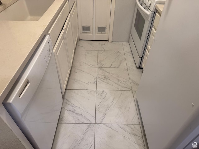 88 W 50 S Unit A4, Centerville, UT 84014 - kitchen with dishwashing machine, light marble finish floors, electric stove, and white cabinets