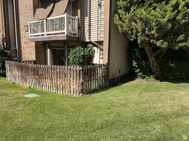 88 W 50 S Unit A4, Centerville, UT 84014 - view of property exterior featuring a balcony and brick siding