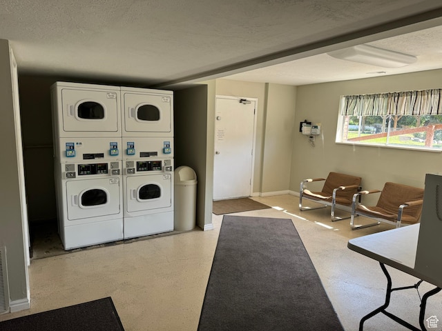 88 W 50 S Unit A4, Centerville, UT 84014 - communal laundry room featuring estacked washer and dryer and a textured ceiling