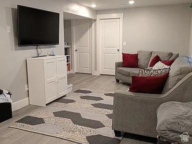 81 S T St, Eureka, UT 84628 - living room featuring wood finished floors and recessed lighting
