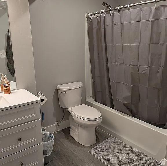 81 S T St, Eureka, UT 84628 - bathroom with shower / bath combo with shower curtain, vanity, and wood finished floors