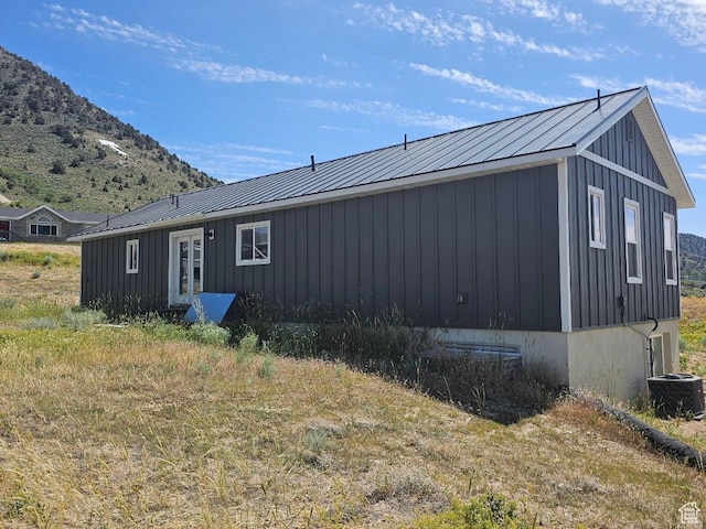 81 S T St, Eureka, UT 84628 - view of home's exterior featuring board and batten siding, a mountain view, and a metal roof