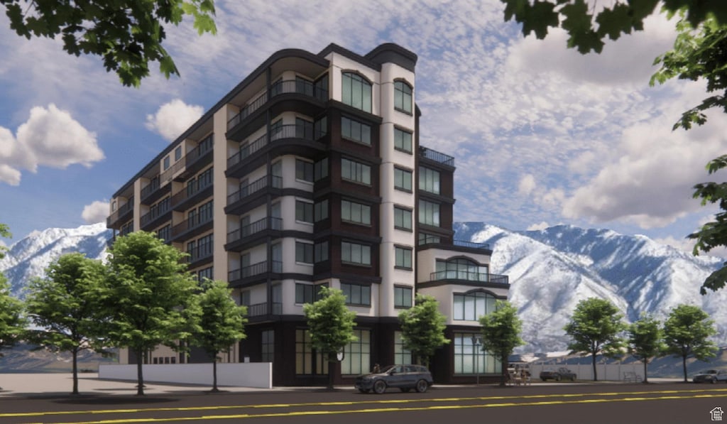149 E Vine St, Murray, UT 84107 - view of building exterior with a mountain view