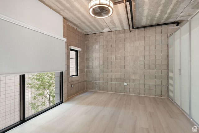 360 W 300 S Unit 233, Salt Lake City, UT 84101 - unfurnished room featuring wood finished floors and concrete block wall