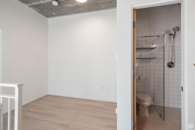 360 W 300 S Unit 233, Salt Lake City, UT 84101 - bathroom with wood finished floors and tile walls