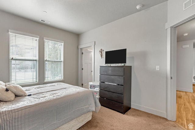 1051 S 500 E Unit E101, Heber City, UT 84032 - bedroom with baseboards and light carpet