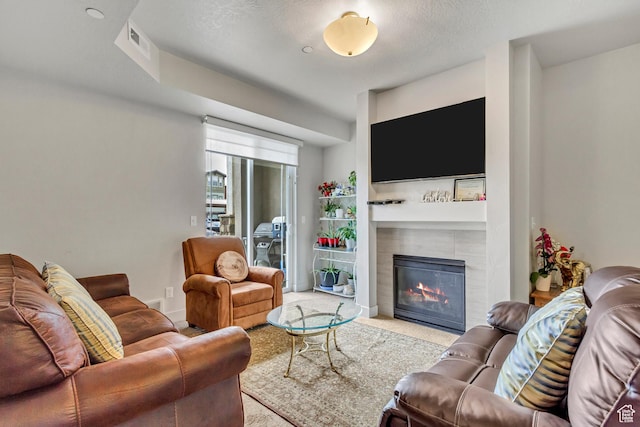 1051 S 500 E Unit E101, Heber City, UT 84032 - carpeted living room with a tiled fireplace