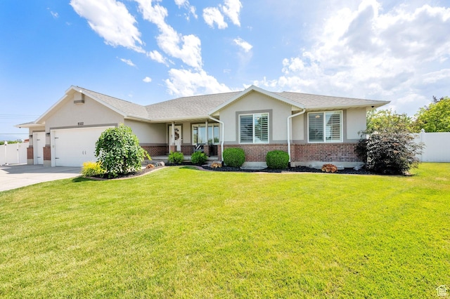 8322 S Copper Vista Cir, West Jordan, UT 84081 - ranch-style home with brick siding, a garage, concrete driveway, and stucco siding
