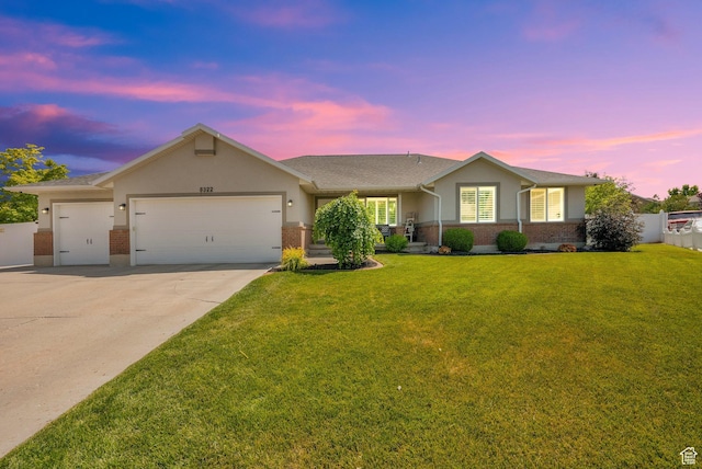 8322 S Copper Vista Cir, West Jordan, UT 84081 - ranch-style house featuring a garage, concrete driveway, brick siding, a yard, and stucco siding