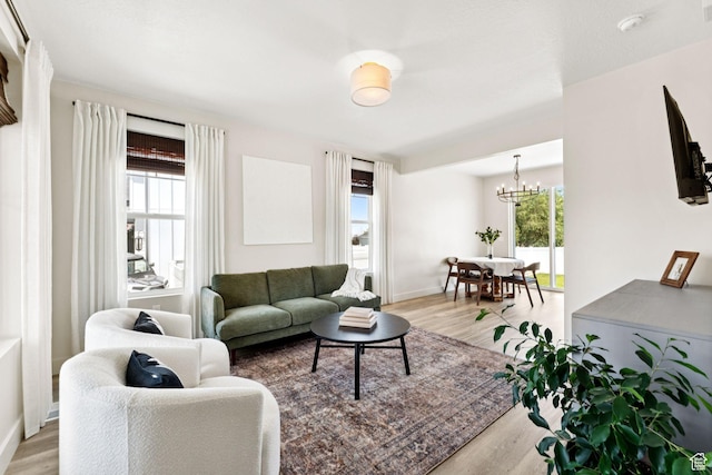 579 E Kings Lndg, Tooele, UT 84074 - living room featuring a chandelier and light wood finished floors
