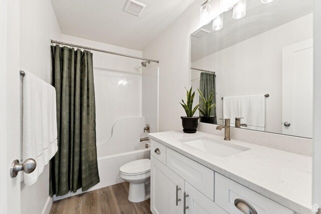 579 E Kings Lndg, Tooele, UT 84074 - bathroom featuring vanity, wood finished floors, and shower / bathtub combination with curtain