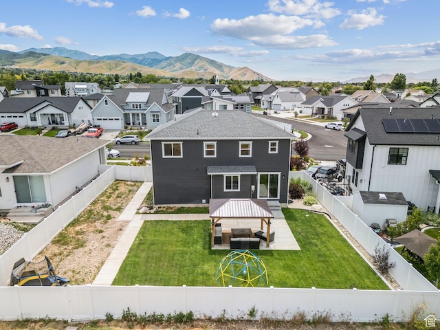 579 E Kings Lndg, Tooele, UT 84074 - rear view of house featuring a residential view, a fenced backyard, and a mountain view