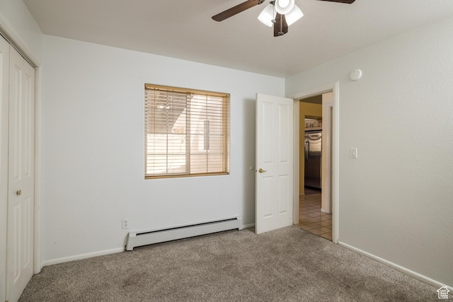 542 W Hale Ave, Moab, UT 84532 - unfurnished bedroom featuring a baseboard radiator, carpet floors, a closet, and a ceiling fan