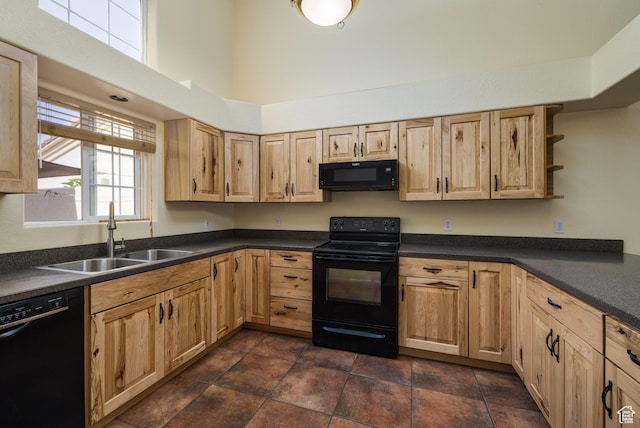 542 W Hale Ave, Moab, UT 84532 - kitchen with black appliances, dark countertops, a towering ceiling, light brown cabinets, and open shelves