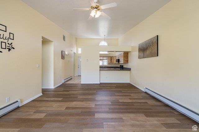 542 W Hale Ave, Moab, UT 84532 - unfurnished living room featuring baseboard heating, a baseboard heating unit, ceiling fan, and wood finished floors