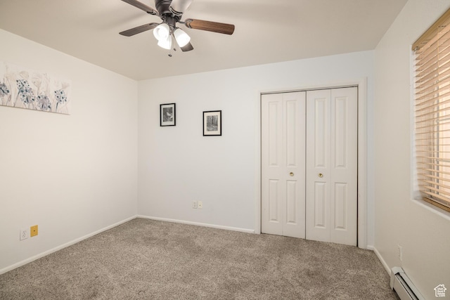 542 W Hale Ave, Moab, UT 84532 - unfurnished bedroom featuring a baseboard heating unit, carpet, a closet, and ceiling fan