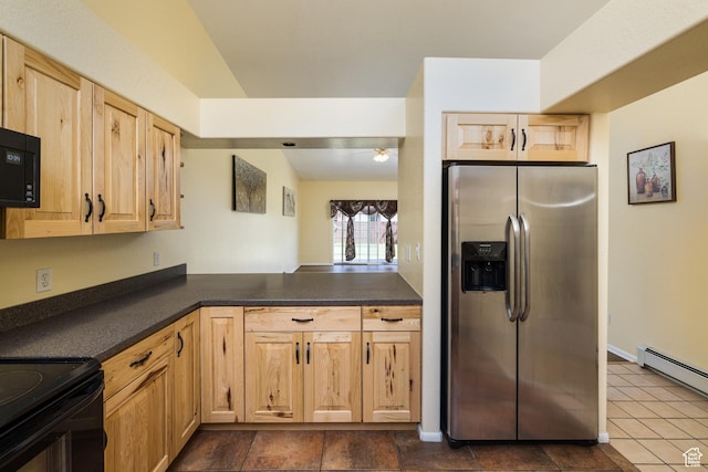 542 W Hale Ave, Moab, UT 84532 - kitchen with black appliances, light brown cabinetry, dark countertops, and a baseboard heating unit