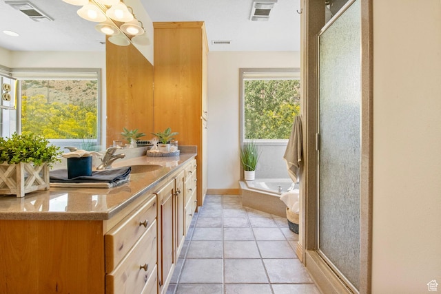 924 Redford Dr, Provo, UT 84604 - bathroom with vanity, a garden tub, a stall shower, and a chandelier