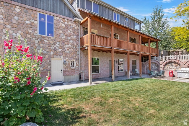 924 Redford Dr, Provo, UT 84604 - back of property featuring a patio area, brick siding, and stone siding
