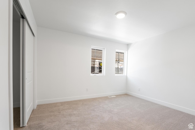1590 S 900 W Unit 204, Salt Lake City, UT 84104 - unfurnished bedroom with light carpet and a closet
