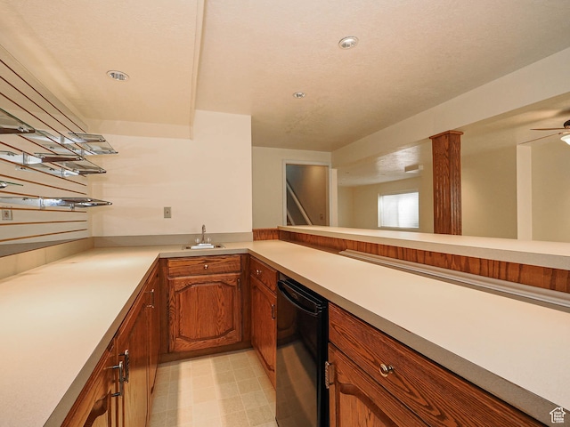 6948 S 855 E, Midvale, UT 84047 - kitchen with light countertops, light floors, brown cabinetry, ceiling fan, and fridge