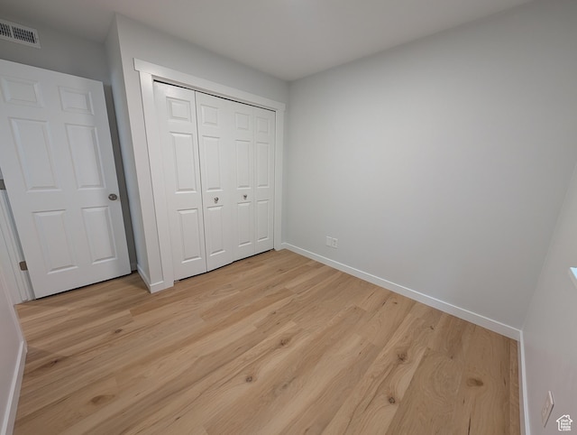 623 S 500 W Unit 17, Provo, UT 84601 - unfurnished bedroom featuring light wood-style flooring and a closet