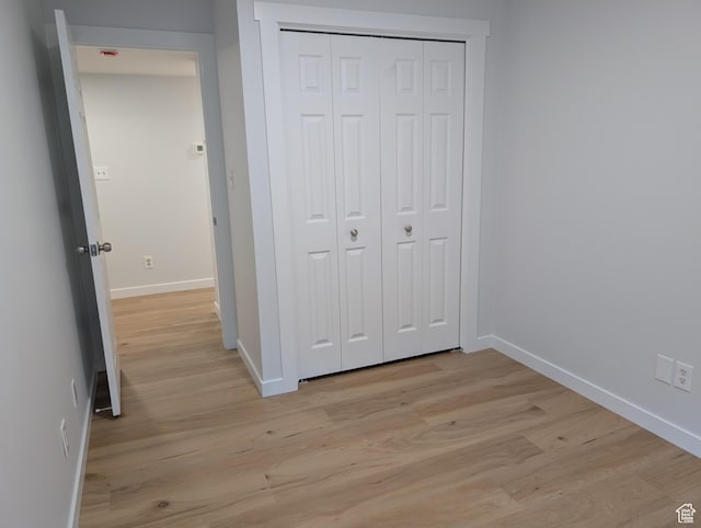 623 S 500 W Unit 17, Provo, UT 84601 - unfurnished bedroom with light wood-style floors and a closet