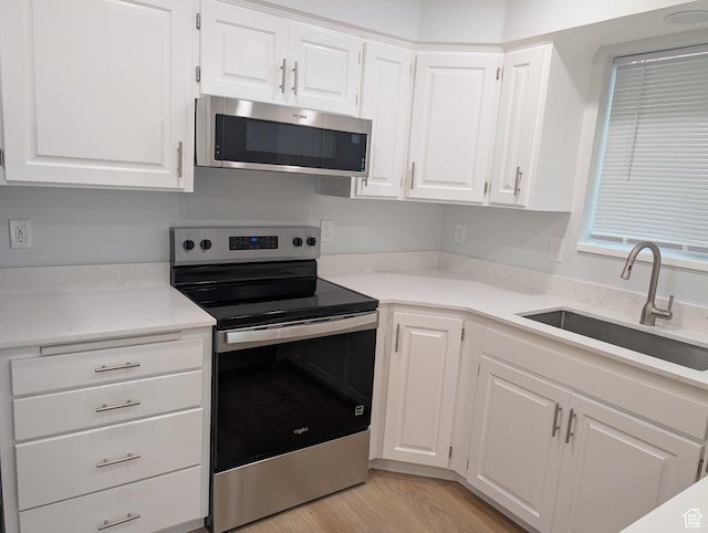 623 S 500 W Unit 17, Provo, UT 84601 - kitchen with stainless steel appliances, white cabinets, and light countertops