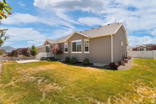 6856 W 8060 S, West Jordan, UT 84081 - rear view of property featuring stucco siding and a shingled roof