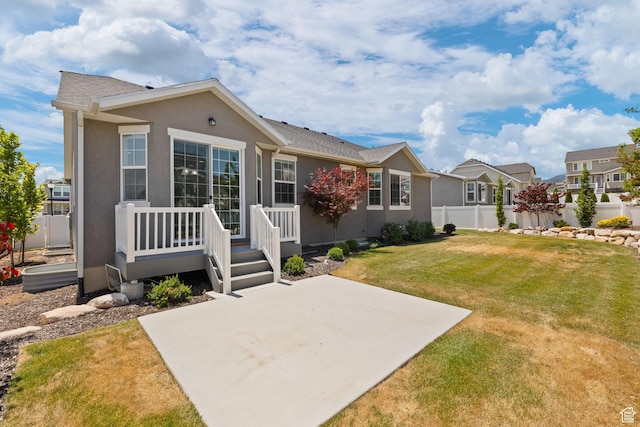 6856 W 8060 S, West Jordan, UT 84081 - rear view of house with a patio, stucco siding, and a residential view