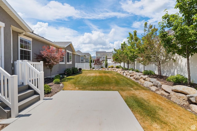 6856 W 8060 S, West Jordan, UT 84081 - fenced backyard featuring a residential view and a patio