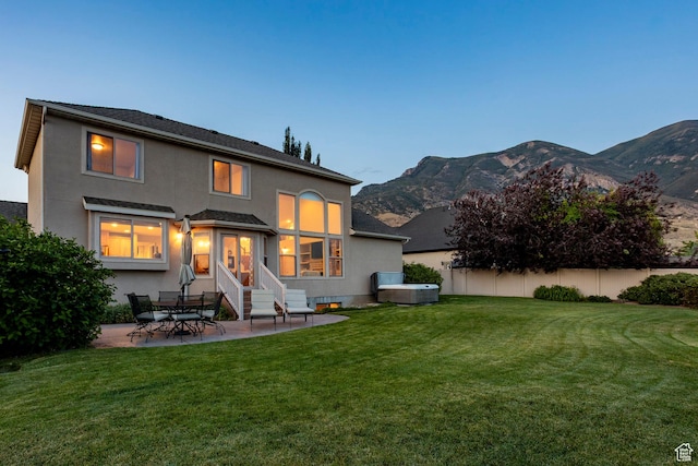 4179 W Sandalwood Dr, Cedar Hills, UT 84062 - back of house featuring stucco siding, a patio area, a mountain view, and entry steps