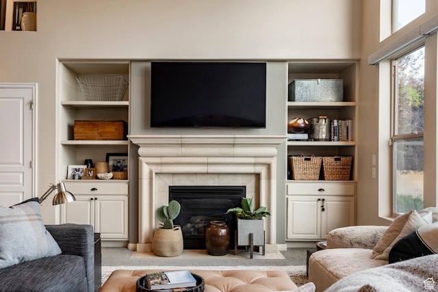 4179 W Sandalwood Dr, Cedar Hills, UT 84062 - carpeted living area featuring built in features and a tiled fireplace