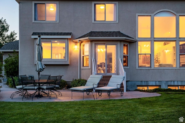 4179 W Sandalwood Dr, Cedar Hills, UT 84062 - back of house featuring a patio, a lawn, and stucco siding
