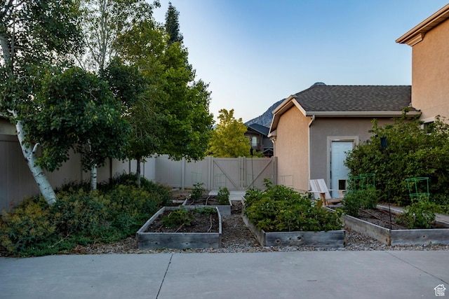 4179 W Sandalwood Dr, Cedar Hills, UT 84062 - view of yard featuring a vegetable garden and a gate