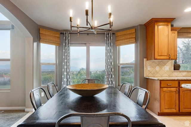 4179 W Sandalwood Dr, Cedar Hills, UT 84062 - dining space with a chandelier and arched walkways