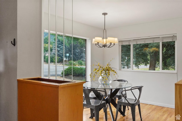 2335 Fillmore Ave, Ogden, UT 84401 - dining space featuring a chandelier, plenty of natural light, and light wood-style flooring