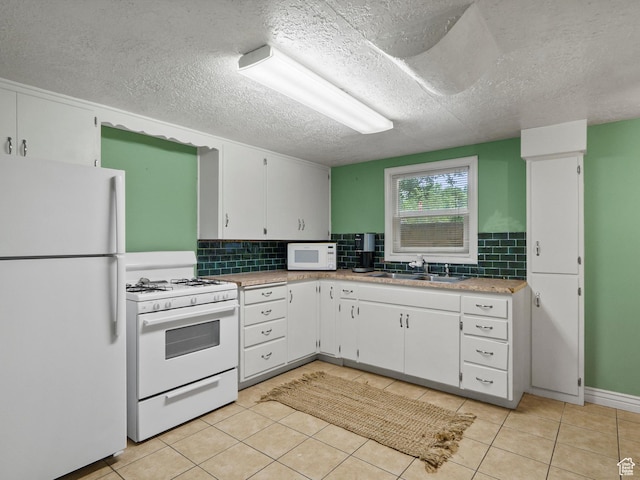 2335 Fillmore Ave, Ogden, UT 84401 - kitchen featuring white appliances, tasteful backsplash, white cabinetry, light countertops, and a textured ceiling