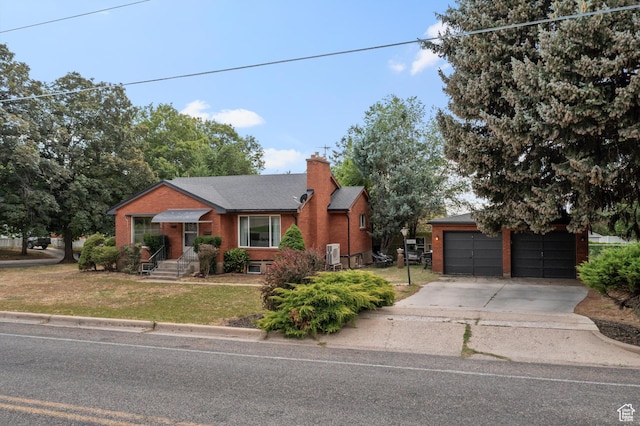 2335 Fillmore Ave, Ogden, UT 84401 - view of front of home featuring brick siding, a front lawn, a chimney, driveway, and a shingled roof