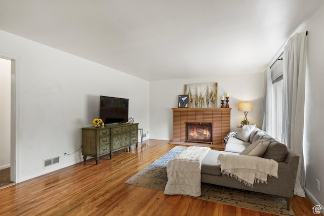 2335 Fillmore Ave, Ogden, UT 84401 - living area with wood finished floors and a fireplace