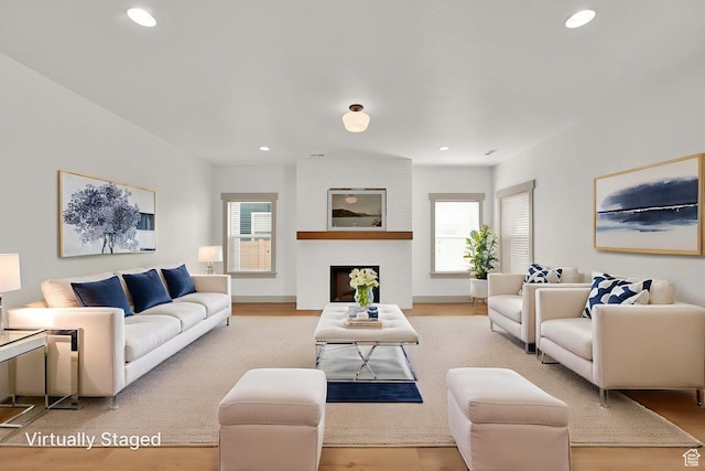4961 E Oakwood Dr, Eagle Mountain, UT 84005 - living area with healthy amount of natural light, wood finished floors, and recessed lighting
