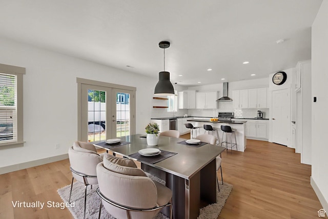 4961 E Oakwood Dr, Eagle Mountain, UT 84005 - dining room featuring french doors, light wood-style flooring, and recessed lighting