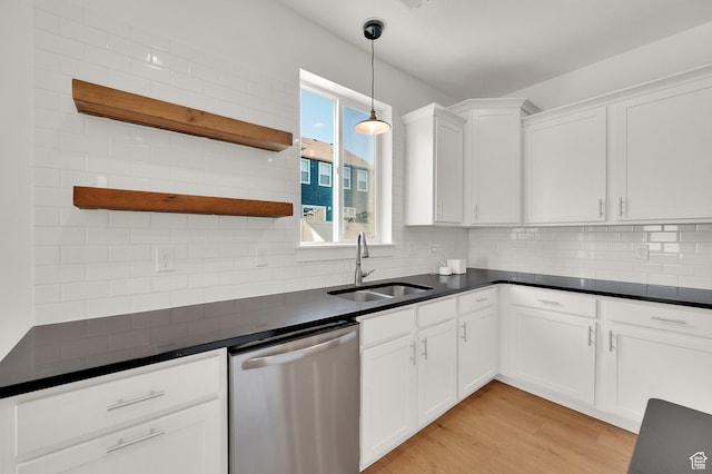 4961 E Oakwood Dr, Eagle Mountain, UT 84005 - kitchen featuring dishwasher, open shelves, dark countertops, and white cabinetry