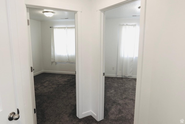 54 N Heading Row, Saratoga Springs, UT 84045 - corridor featuring dark colored carpet and baseboards