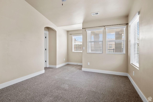 1556 N Venetian Way W, Saratoga Springs, UT 84045 - empty room with light carpet and arched walkways