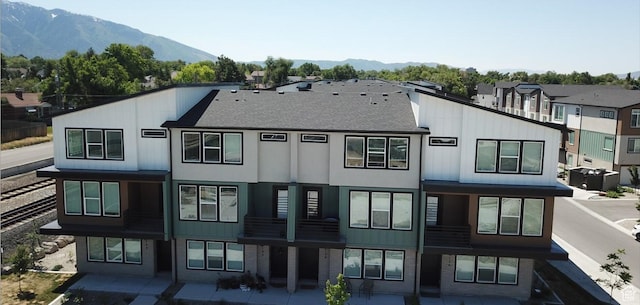 136 E Abbeville Ct, Sandy, UT 84070 - rear view of property featuring a mountain view and a shingled roof