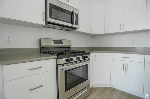 136 E Abbeville Ct, Sandy, UT 84070 - kitchen with stainless steel appliances and white cabinets