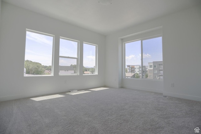 136 E Abbeville Ct, Sandy, UT 84070 - empty room featuring healthy amount of natural light and carpet