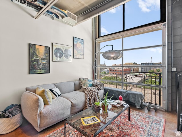 360 W Broadway S Unit 619, Salt Lake City, UT 84101 - living room featuring a towering ceiling and concrete flooring
