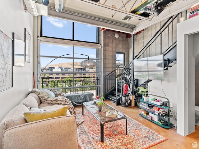 360 W Broadway S Unit 619, Salt Lake City, UT 84101 - living room featuring concrete flooring and stairway